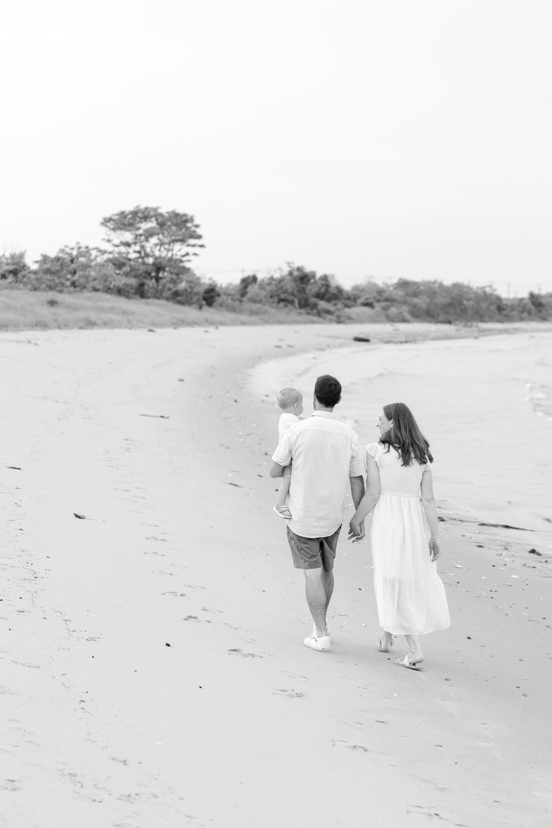 family portrait walking on the beach