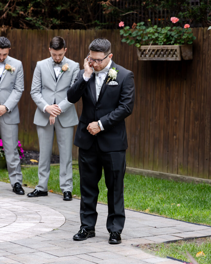 emotional groom's first look outdoor ceremony 