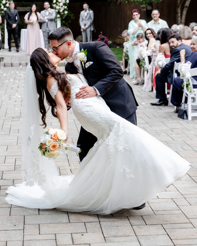 bride and groom first kiss outdoor ceremony 