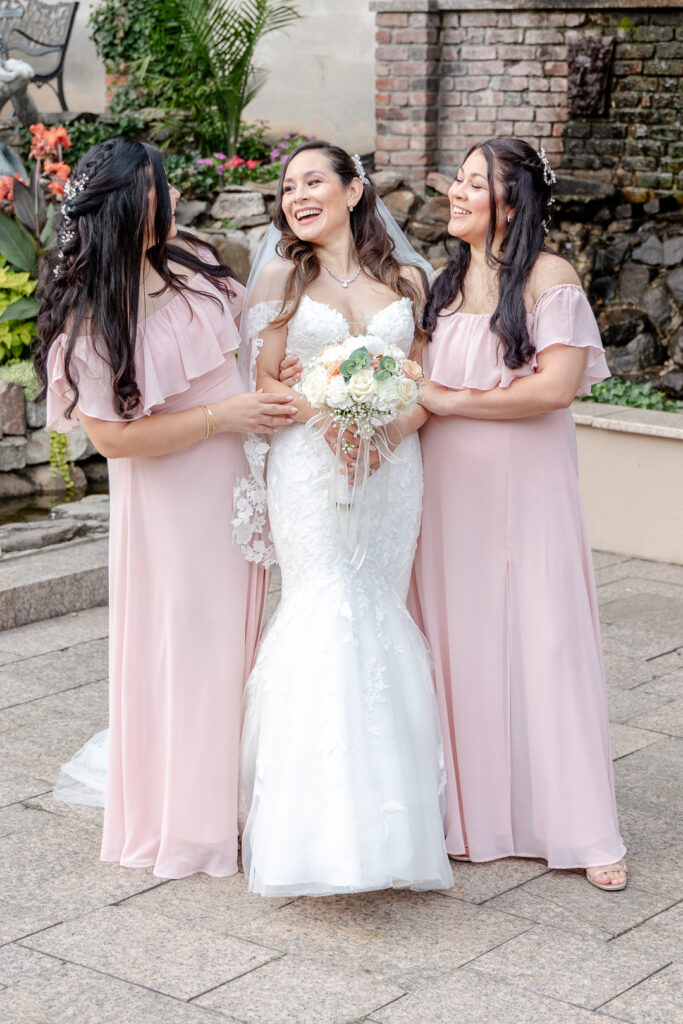 bride and bridesmaids in blush