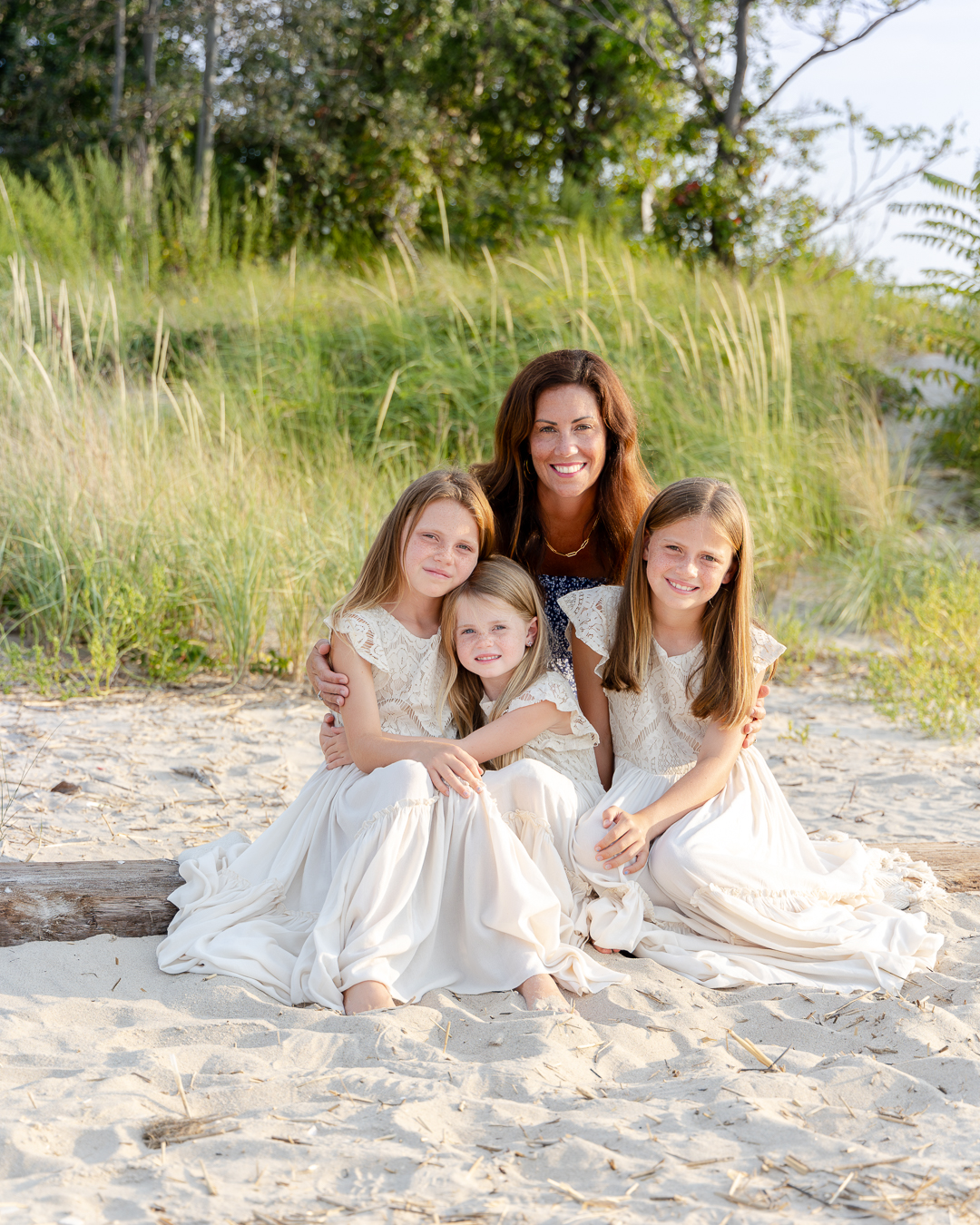 mother and 3 children on the beach at golden hour family portrait