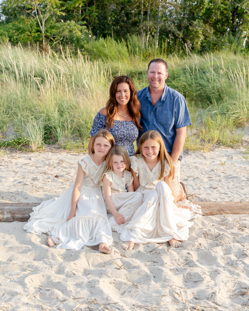 family of 5 portraits on the beach with tall grass
