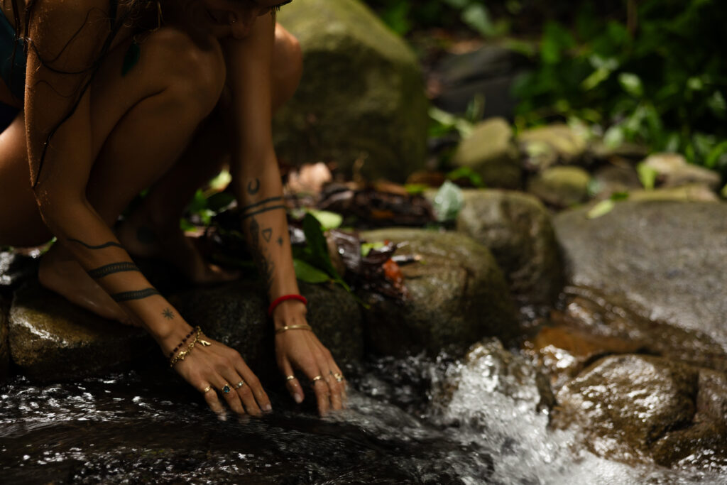 ethereal photo of hands in the river 