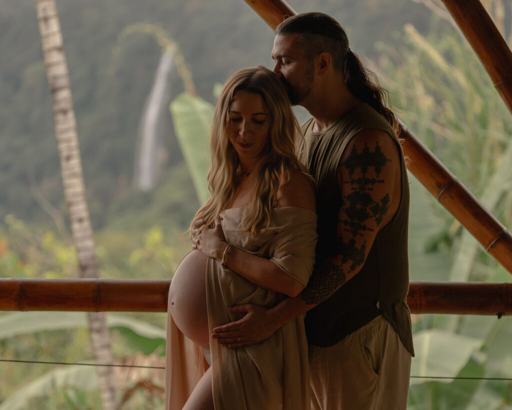 moody Maternity Photography by a waterfall
